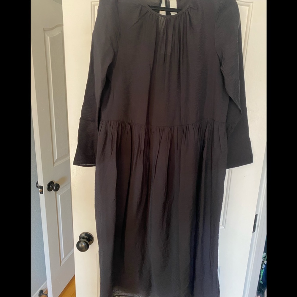 Mid calf black dress can be used as a cover up or put a slip to it.